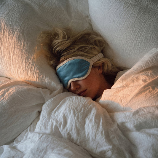 Blue silk sleep mask with lavender for calm bedtime rest